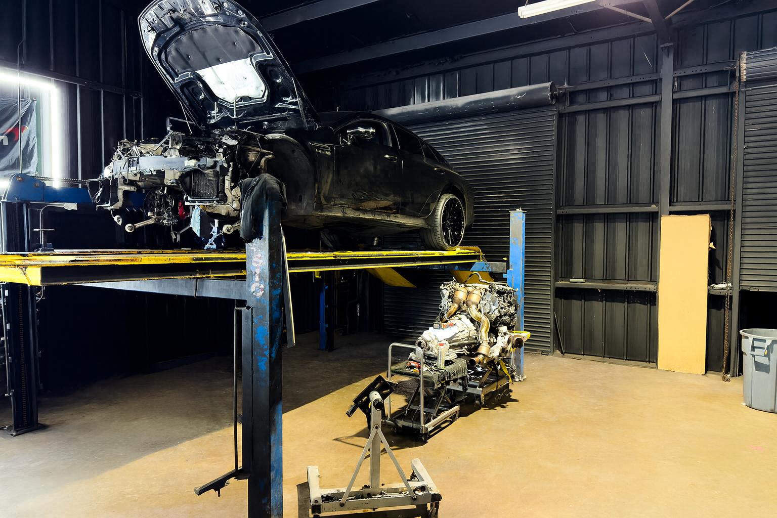 AMG GT 63 on lift with engine removed - Complete Engine Extraction